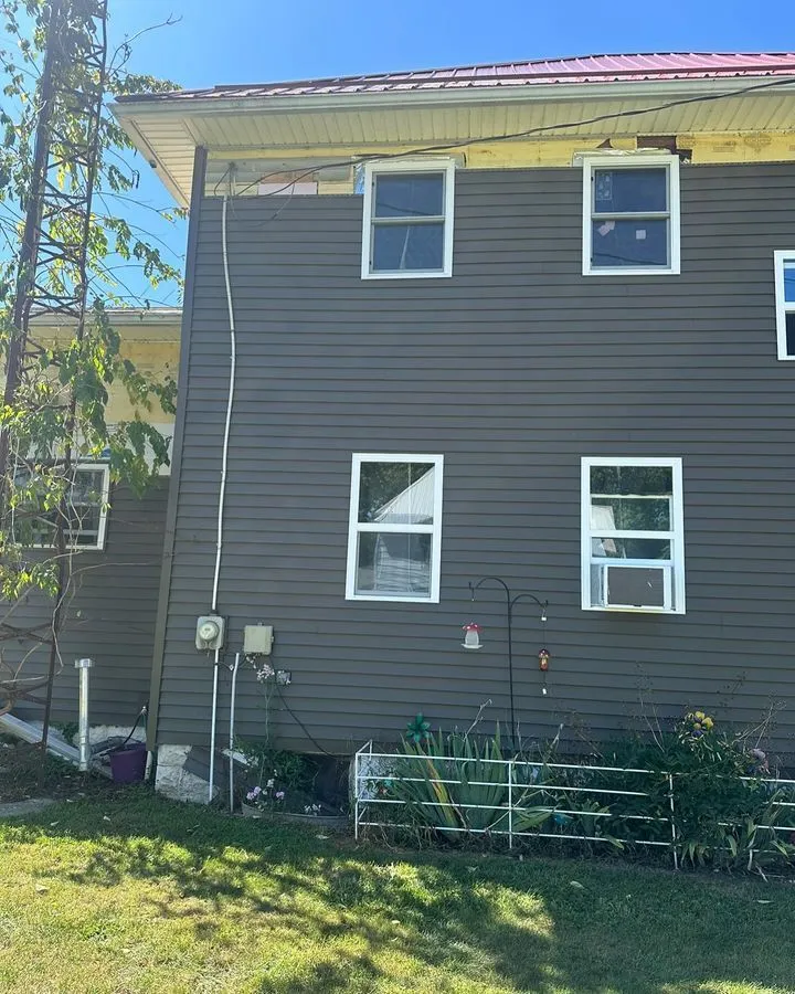 Exterior service conduit run up a sided wall